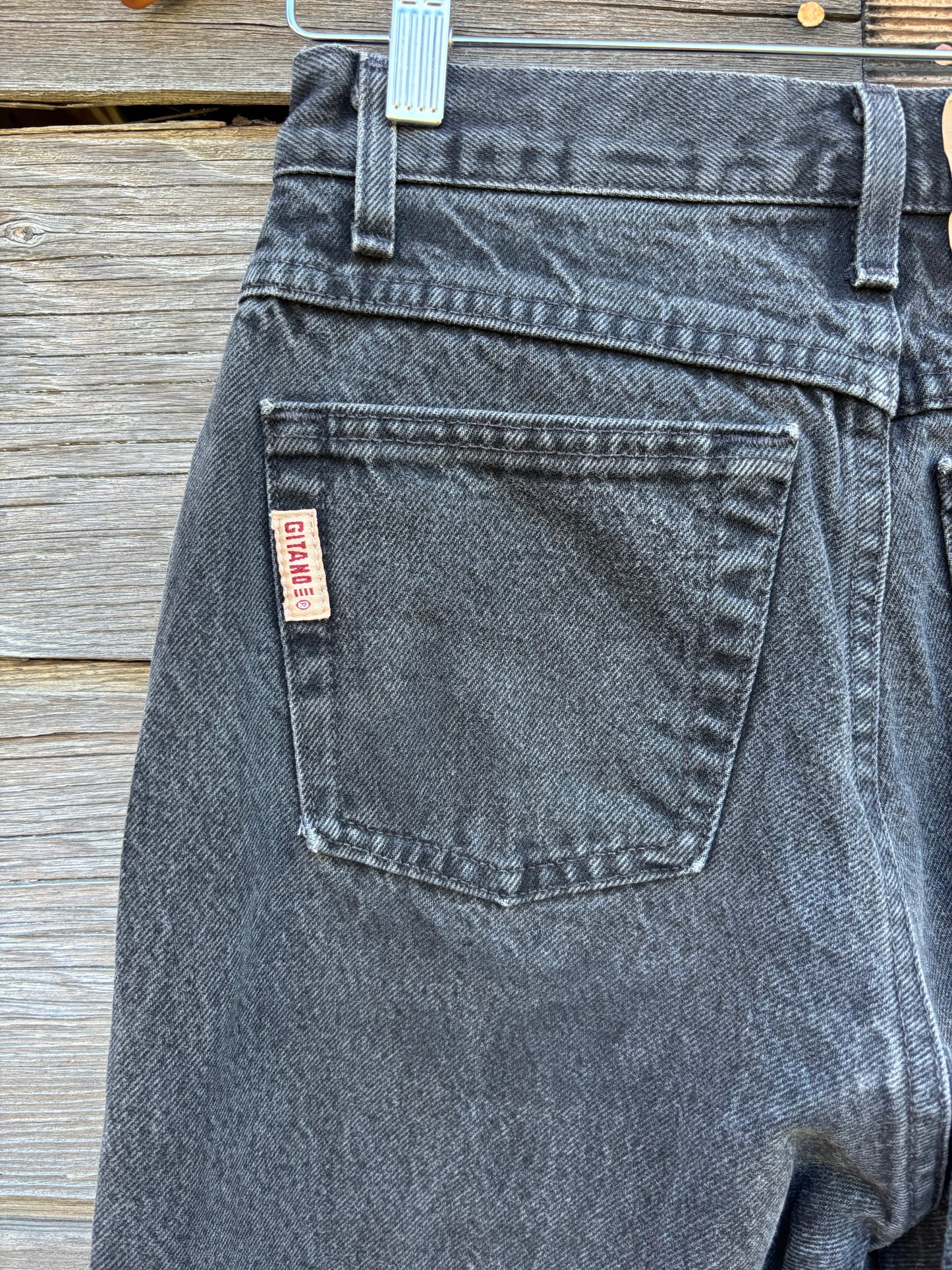Up close view of back pocket and Gitano label on a pair of black vintage jeans, photo shows the perfect vintage wear and fade on the denim