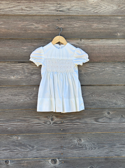 White smocked baby dress